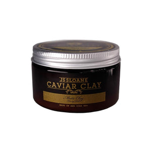 JS Sloane Caviar Clay, vista frontal de tarro color ámbar con tapa plateada