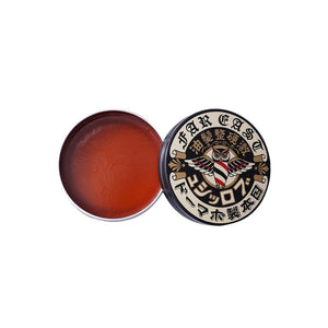 BROSH Hard Pomade, lata abierta con textura naranja sobre fondo blanco