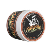 Suavecito Clay Pomade, tarro cerrado en ángulo con tapa naranja y logo