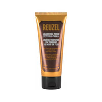 Reuzel Grooming Tonic Texture Cream - vista frontal de tubo marrón dorado sobre fondo blanco