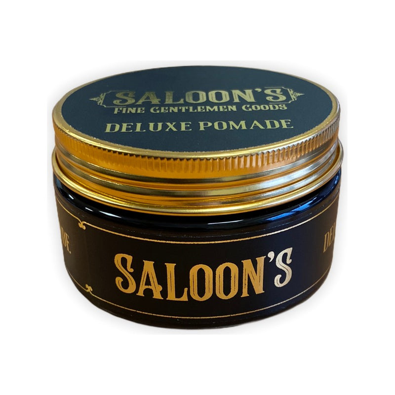 Saloon's Deluxe Pomade, tarro negro y dorado con tapa cerrada, vista frontal