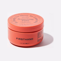 Firsthand Supply Pasta texturizante, vista frontal del tarro naranja cerrado con tapa