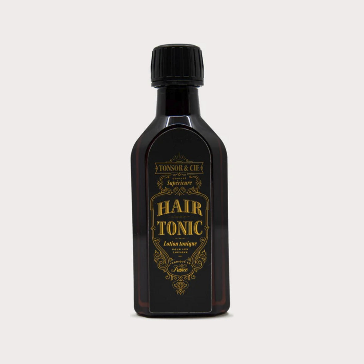 Tonsor & Cie Hair Tonic Citrus, vista frontal de botella oscura con etiqueta dorada