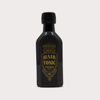 Tonsor & Cie Hair Tonic Citrus, vista frontal de botella oscura con etiqueta dorada