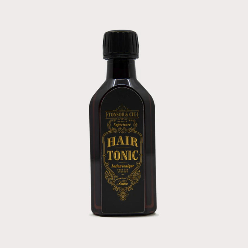 Tonsor & Cie Hair Tonic Citrus, vista frontal de botella oscura con etiqueta dorada